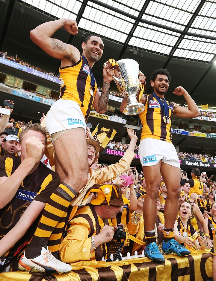 2015 Toyota AFL Grand Final - Hawthorn v West Coast MELBOURNE, AUSTRALIA - OCTOBER 3: Shaun Burgoyne (L) and Cyril Rioli of the Hawks celebrate the win during the 2015 Toyota AFL Grand Final match between the Hawthorn Hawks and the West Coast Eagles at the Melbourne Cricket Ground, Melbourne, Australia on October 3, 2015. (Photo by Michael Dodge/AFL Media)